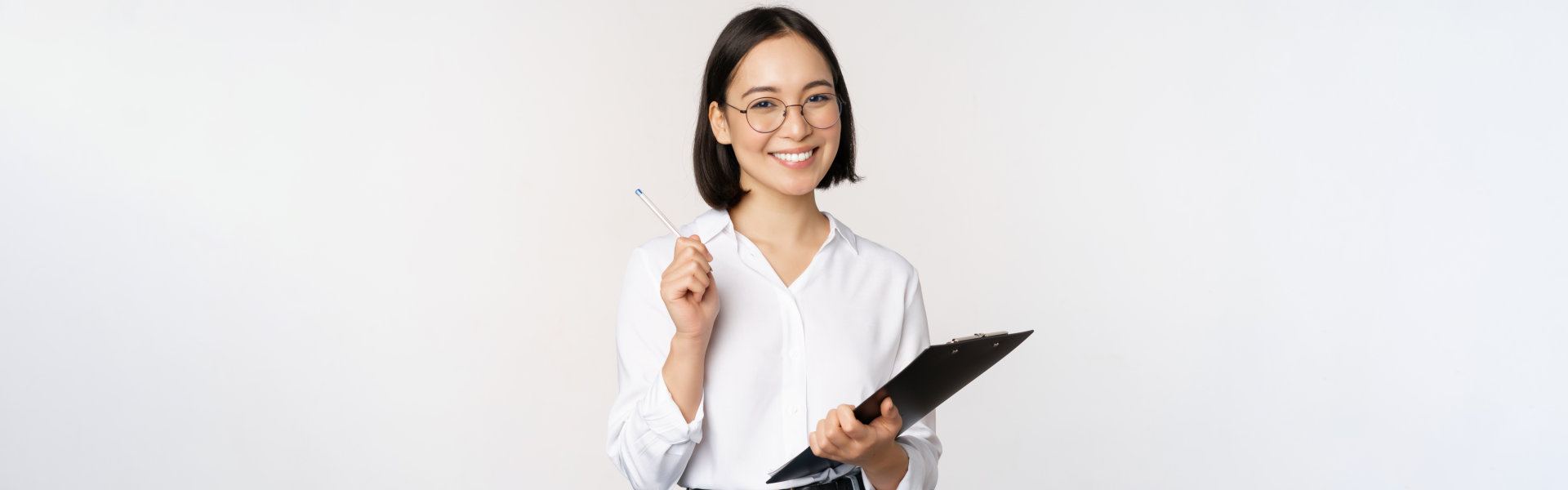 woman holding a pen and a file