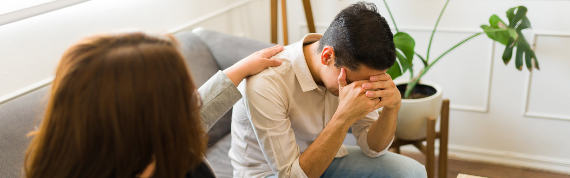 psychiatrist comforting a stressed man